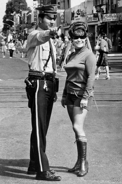 american woman shorts policeman